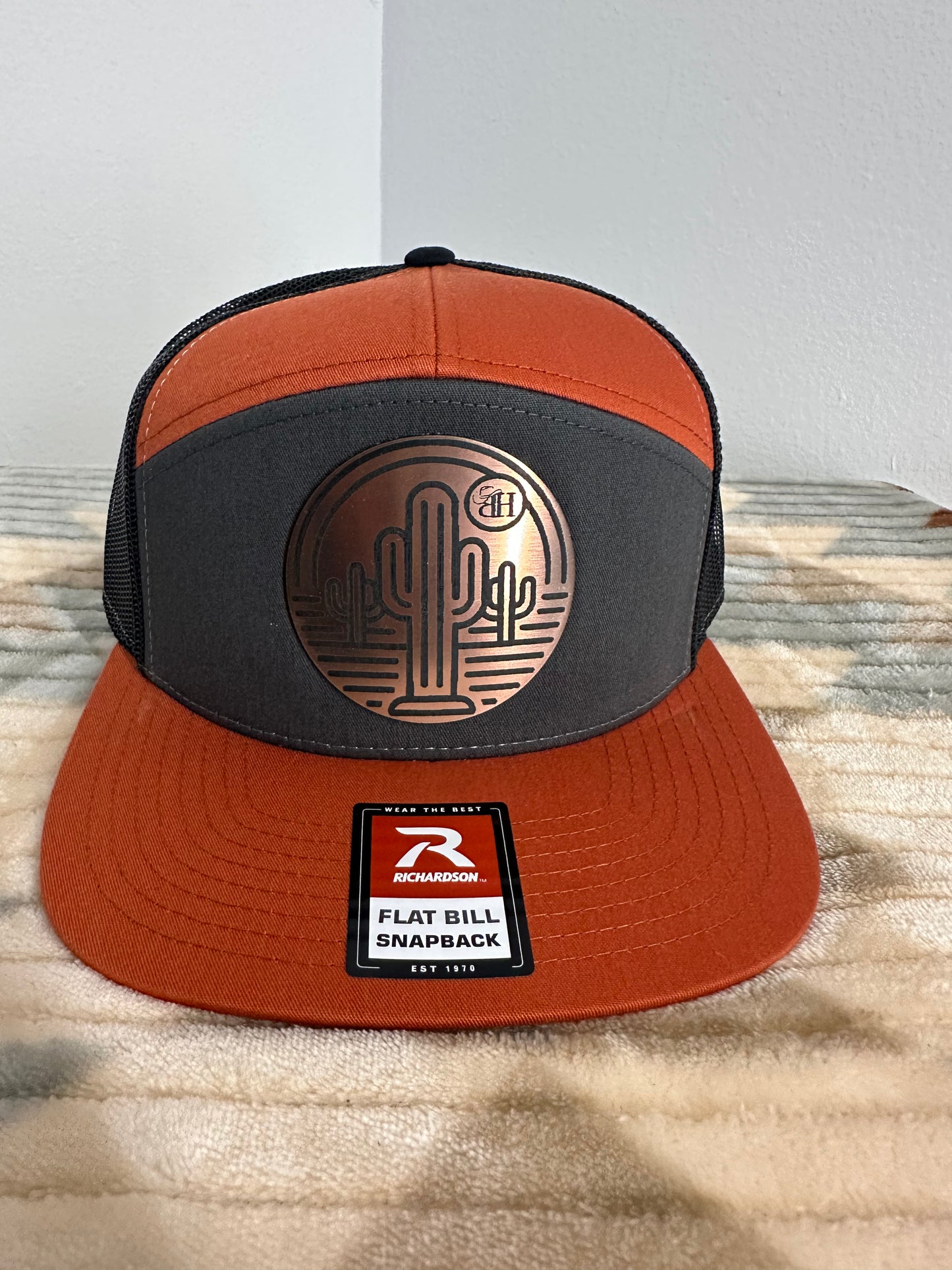 Blazin Halos Orange, Black and Gray Richardson 7 Panel Trucker Hat with Copper Cactus Acrylic Patch